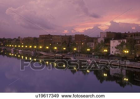 Stock Photo -  New York, Seneca Falls, Finger Lakes, [Sunrise, sunset] over the calm water of Cayuga-Seneca Canal . Fotosearch