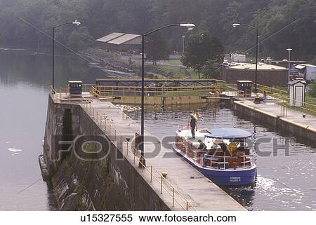 New York, Seneca Falls, Finger Lakes, Cayuga-Seneca Canal. A red, white and blue cruise line boat in double lock, 49 feet drop. View Large Photo Image Stock Photography - New York, Seneca Falls, Finger Lakes, Cayuga-Seneca Canal. A red, white and blue cruise line boat in double lock, 49 feet drop.. Fotosearch