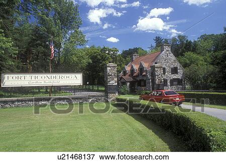 Stock Photo -  New York, Ticonderoga, Adirondack Park, Adirondacks, Car driving through entrance to Fort Ticonderoga in the state of New York. . Fotosearch