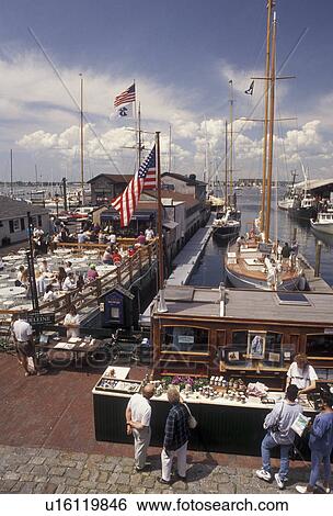 Newport, Newport Harbor, seaport, Rhode Island, The Mooring, People enjoying a sunny day on Sayer's Wharf in The Mooring at Newport's colonial seaport in the state of Rhode Island. View Large Photo Image Stock Photograph - Newport, Newport Harbor, seaport, Rhode Island, The Mooring, People enjoying a sunny day on Sayer's Wharf in The Mooring at Newport's colonial seaport in the state of Rhode Island. . Fotosearch