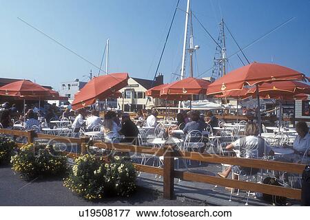 Stock Photo -  Newport, outdoor cafe, Rhode Island, People relaxing at an outdoor cafe at Bowen's Wharf in Newport, Rhode Island.. Fotosearch