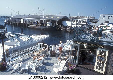 Newport, Rhode Island, People relaxing on the deck of The Coffee Grinder coffee shop at Bowen's Wharf in Newport, Rhode Island. View Large Photo Image Stock Image - Newport, Rhode Island, People relaxing on the deck of The Coffee Grinder coffee shop at Bowen's Wharf in Newport, Rhode Island.. Fotosearch