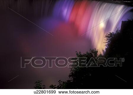 Stock Photo -  Niagara Falls, Canada, Ontario, Horseshoe Falls are illuminated at night (evening) in Niagara Falls.. Fotosearch