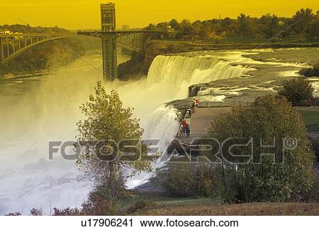 Niagara Falls, New York, Scenic view of Bridal Veil Falls in Niagara Falls in the state of New York. Rainbow bridge in the background View Large Photo Image Stock Image - Niagara Falls, New York, Scenic view of Bridal Veil Falls in Niagara Falls in the state of New York. Rainbow bridge in the background . Fotosearch