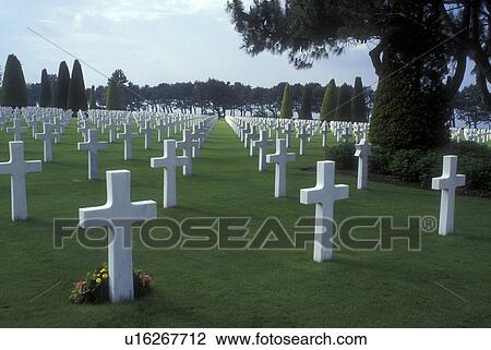 Stock Image -  Normandy, France, Omaha Beach, Calvados, Europe, Grave sites marked with crosses for the men who lost their lives during the D-Day landings at the American Military Cemetery near Omaha Beach.. Fotosearch