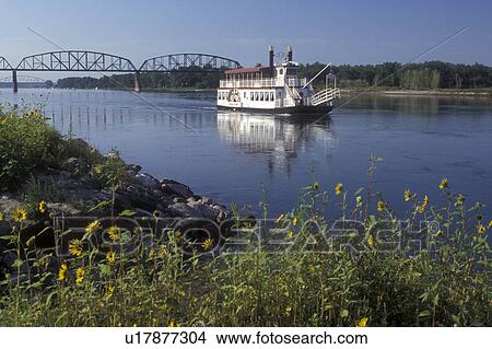 North Dakota, Bismarck, The Lewis & Clark Riverboat sightseeing cruise slowly coasts down the Missouri River in Bismarck. A bridge spans the river in the background View Large Photo Image Picture - North Dakota, Bismarck, The Lewis & Clark Riverboat sightseeing cruise slowly coasts down the Missouri River in Bismarck. A bridge spans the river in the background . Fotosearch