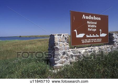 Stock Image -  North Dakota, Entrance sign to Audubon National Wildlife Refuge and Lake Sakakawea in Garrison.. Fotosearch
