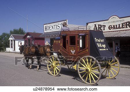 Picture -  North Dakota, Jamestown, A stagecoach pulled by a team of horses gives rides to visitors through the re-created late 19th century Frontier Village in Jamestown . Fotosearch