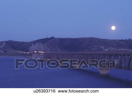 North Dakota, Moon rise over Lake Sakakawea and Four Bears Bridge at Fort Berthold Indian Reservation in New Town. View Large Photo Image Stock Photograph - North Dakota, Moon rise over Lake Sakakawea and Four Bears Bridge at Fort Berthold Indian Reservation in New Town.. Fotosearch