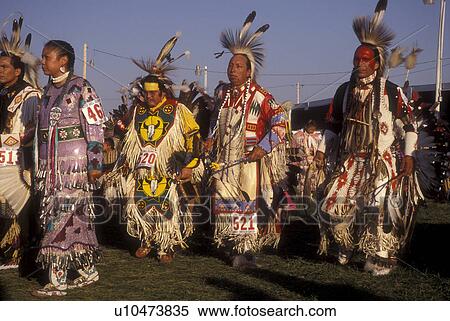 North Dakota, Pow Wow, Native Americans dancing at a tribal dance contest in native costumes at Little Shell Pow Wow on Fort Berthold Indian Reservation in New Town View Large Photo Image Stock Photography - North Dakota, Pow Wow, Native Americans dancing at a tribal dance contest in native costumes at Little Shell Pow Wow on Fort Berthold Indian Reservation in New Town . Fotosearch