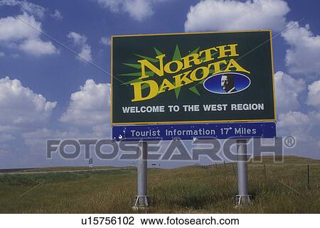 Stock Image -  North Dakota, Welcome sign on highway welcomes visitors to North Dakota (welcome sign).. Fotosearch