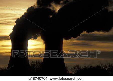 Picture -  nuclear power plant, sunrise, sunset, Pennsylvania, Steam rises from the cooling towers of the Philadelphia Electric Co. nuclear power plant in Limerick at sunset.. Fotosearch