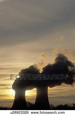 Stock Photograph -  nuclear power plant, sunrise, sunset, Pennsylvania, Steam rises from the cooling towers of the Philadelphia Electric Co. nuclear power plant in Limerick at sunset.. Fotosearch