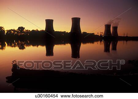 nuclear power plant, Three Mile Island, power, electricity, nuclear, energy, Pennsylvania, The cooling towers at Three Mile Island Nuclear Power Plant reflect in the calm water of the Susquehanna River at sunset (evening) in Middletown in the state of Pe View Large Photo Image Picture - nuclear power plant, Three Mile Island, power, electricity, nuclear, energy, Pennsylvania, The cooling towers at Three Mile Island Nuclear Power Plant reflect in the calm water of the Susquehanna River at sunset (evening) in Middletown in the state of Pe. Fotosearch