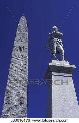 Stock Photograph -  obelisk, battle monument, Vermont, VT, Bennington, The Bennington Battle Monument, a 306 foot obelisk, is the tallest structure in Vermont and the statue of Colonel Seth Warner in Bennington in the spring.. Fotosearch