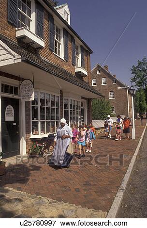 Old Salem, Moravian, Winston-Salem, North Carolina, A group of children follow an interpreter along the cobblestone sidewalk in Old Salem, a living history restoration of the Moravian church town of Salem founded in 1766, in Winston-Salem in the state of View Large Photo Image Stock Photo - Old Salem, Moravian, Winston-Salem, North Carolina, A group of children follow an interpreter along the cobblestone sidewalk in Old Salem, a living history restoration of the Moravian church town of Salem founded in 1766, in Winston-Salem in the state of. Fotosearch