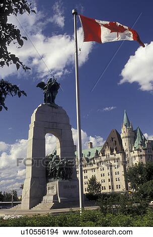 Picture -  Ottawa, Ontario, Canada, Canadian flag flies next to the National War Memorial in Ottawa in the Province of Ontario, Canada.. Fotosearch