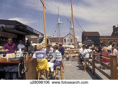 outdoor cafe, Newport, Bannister's Wharf, seaport, Rhode Island, People sitting at an outdoor cafe on Bannister's Wharf at Newport's colonial seaport in the state of Rhode Island. View Large Photo Image Stock Photograph - outdoor cafe, Newport, Bannister's Wharf, seaport, Rhode Island, People sitting at an outdoor cafe on Bannister's Wharf at Newport's colonial seaport in the state of Rhode Island. . Fotosearch