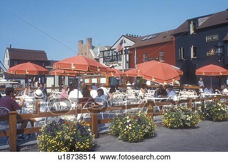 Picture -  outdoor cafe, Newport, Rhode Island, People relaxing at an outdoor cafe at Bowen's Wharf in Newport, Rhode Island.. Fotosearch