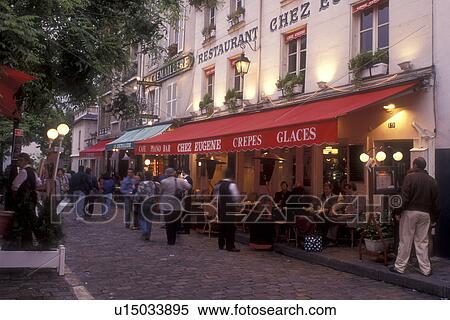 Stock Photography -  outdoor cafe, Paris, France, Europe, Montmartre, People sitting at an outdoor cafe in the [evening, night] at the Place du Tertre in Montmartre.. Fotosearch