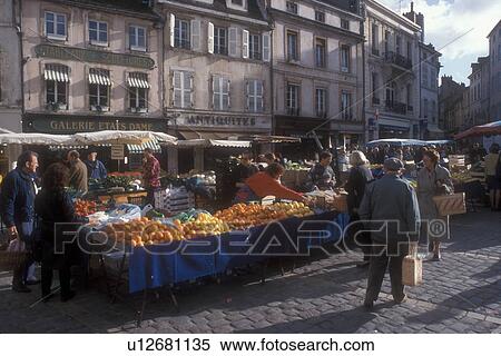 Stock Photography -  outdoor market, Burgundy, France, Beaune, Europe, People shopping at the Saturday Market in the picturesque town of Beaune The Heart of Burgundy, France. . Fotosearch