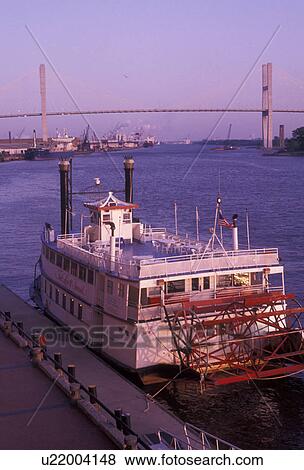 Stock Photo -  paddle-wheeler, riverboat, Savannah, waterfront, Georgia, Riverboat paddle-wheel cruise along the Savannah River and Historic Riverfront of Savannah in the state of Georgia. . Fotosearch