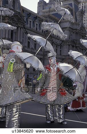 parade, Mummers Parade, Philadelphia, Pennsylvania, Men dressed in costume holding silver umbrellas for the Mummers Parade on New Years Day in Philadelphia in the state of Pennsylvania. View Large Photo Image Stock Image -  parade, Mummers Parade, Philadelphia, Pennsylvania, Men dressed in costume holding silver umbrellas for the Mummers Parade on New Years Day in Philadelphia in the state of Pennsylvania.. Fotosearch