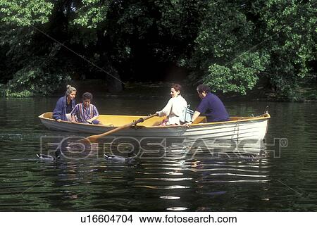 Paris, France, Europe, Bois de Boulogne, row boat, Two couples rowing a boat in Lac Inferieur on a beautiful spring day at Bois de Boulogne in Paris. View Large Photo Image Picture - Paris, France, Europe, Bois de Boulogne, row boat, Two couples rowing a boat in Lac Inferieur on a beautiful spring day at Bois de Boulogne in Paris. . Fotosearch