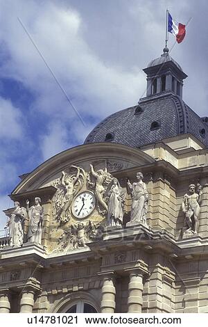 Paris, France, Europe, Palais du Luxembourg. Beautiful sculptures adorn the clock tower of the Luxembourg Palace. The flag of France flies on top of the dome. View Large Photo Image Stock Image - Paris, France, Europe, Palais du Luxembourg. Beautiful sculptures adorn the clock tower of the Luxembourg Palace. The flag of France flies on top of the dome.. Fotosearch