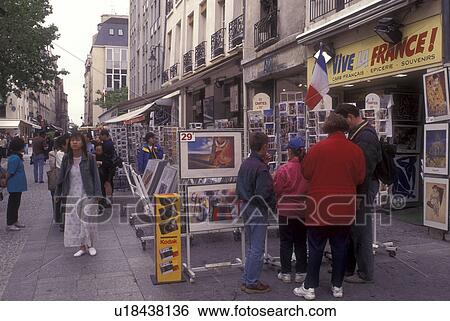 Stock Photograph -  Paris, France, Europe, People shopping at boutiques and souvenir shops along Beaubourg in Paris.. Fotosearch