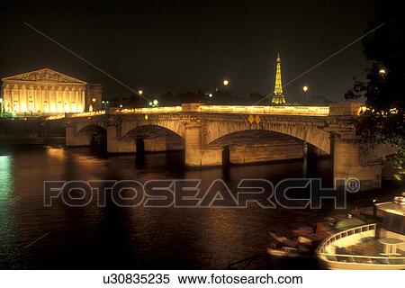 Stock Photography -  Paris, France, Europe, Seine River, The Pont de la Concorde is lit up at [night, evening] over the Seine River in Paris.. Fotosearch