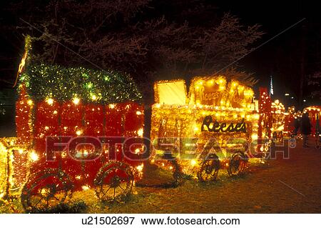 Pennsylvania, Hershey, Hershey Park, A train with Christmas lights decorates Hershey Chocolate World in the evening. View Large Photo Image Stock Photo - Pennsylvania, Hershey, Hershey Park, A train with Christmas lights decorates Hershey Chocolate World in the evening.. Fotosearch