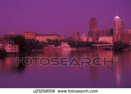 Stock Photo -  Philadelphia, downtown, skyline, sunset, Pennsylvania, Reflection of the downtown skyline and Philadelphia Museum of Art of Philadelphia along the Schuylkill River at sunset in the state of Pennsylvania. (blue/red filter) . Fotosearch
