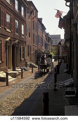 Philadelphia, Elfreth's Alley, horse-drawn carriage, Pennsylvania, Horse-drawn carriage rides along the narrow street of Elfreth's Alley in historical downtown Philadelphia in the state of Pennsylvania. View Large Photo Image Stock Image - Philadelphia, Elfreth's Alley, horse-drawn carriage, Pennsylvania, Horse-drawn carriage rides along the narrow street of Elfreth's Alley in historical downtown Philadelphia in the state of Pennsylvania. . Fotosearch
