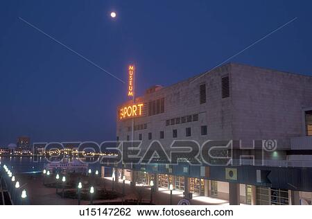 Stock Image -  Philadelphia, Pennsylvania, Penn's Landing, museum, Moonrise above the Independence Seaport Museum at night on Historic Penn's Landing on the Delaware River in Philadelphia, Pennsylvania.. Fotosearch