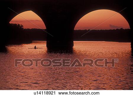 Philadelphia, Schuylkill River, bridge, Pennsylvania, Fairmount Park, Rowing on the Schuylkill River under an arched bridge at sunset in Philadelphia in the state of Pennsylvania. View Large Photo Image Stock Image - Philadelphia, Schuylkill River, bridge, Pennsylvania, Fairmount Park, Rowing on the Schuylkill River under an arched bridge at sunset in Philadelphia in the state of Pennsylvania. . Fotosearch