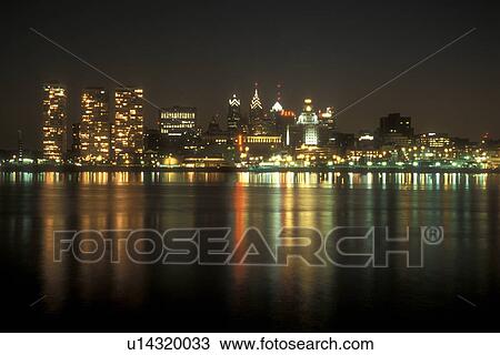 Philadelphia, skyline, Pennsylvania, The illuminated skyline of downtown Philadelphia reflects in the calm waters of the Delaware River in the evening, Pennsylvania. View Large Photo Image Stock Image - Philadelphia, skyline, Pennsylvania, The illuminated skyline of downtown Philadelphia reflects in the calm waters of the Delaware River in the evening, Pennsylvania.. Fotosearch