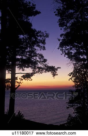 Pictured Rocks, Lake Superior, Upper Peninsula, U. P Michigan, silhouette, Scenic view of Lake Superior at sunset at Pictured Rocks National Lakeshore in Munising in the state of Michigan. View Large Photo Image Stock Photo - Pictured Rocks, Lake Superior, Upper Peninsula, U. P Michigan, silhouette, Scenic view of Lake Superior at sunset at Pictured Rocks National Lakeshore in Munising in the state of Michigan.. Fotosearch