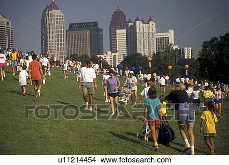 Picture -  Piedmont Park, 10K Peachtree Road Race, Atlanta, Georgia, A crowd of people gather in Piedmont Park after the 10K Peachtree Road Race in Atlanta in the state of Georgia.. Fotosearch