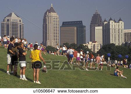 Stock Photo -  Piedmont Park, 10K Peachtree Road Race, Atlanta, running, Georgia, A crowd of people gather in Piedmont Park after the 10K Peachtree Road Race in Atlanta in the state of Georgia.. Fotosearch