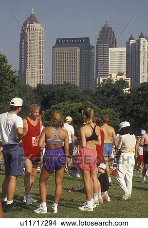 Piedmont Park, Peachtree Road Race, Atlanta, running, Georgia, A group of runners gather in Piedmont Park after the 10K Peachtree Road Race in Atlanta in the state of Georgia. View Large Photo Image Picture - Piedmont Park, Peachtree Road Race, Atlanta, running, Georgia, A group of runners gather in Piedmont Park after the 10K Peachtree Road Race in Atlanta in the state of Georgia.. Fotosearch