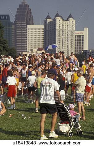 Piedmont Park, Peachtree Road Race, Atlanta, running, Georgia, A crowd of people gather in Piedmont Park after the 10K Peachtree Road Race in Atlanta in the state of Georgia. View Large Photo Image Stock Image - Piedmont Park, Peachtree Road Race, Atlanta, running, Georgia, A crowd of people gather in Piedmont Park after the 10K Peachtree Road Race in Atlanta in the state of Georgia.. Fotosearch