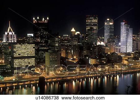 Pittsburgh, aerial, skyline, Pennsylvania, Downtown skyline of Pittsburgh illuminated at night in the state of Pennsylvania. City lights reflect in the calm waters of the Monongahela River. View Large Photo Image Stock Photo - Pittsburgh, aerial, skyline, Pennsylvania, Downtown skyline of Pittsburgh illuminated at night in the state of Pennsylvania. City lights reflect in the calm waters of the Monongahela River.. Fotosearch