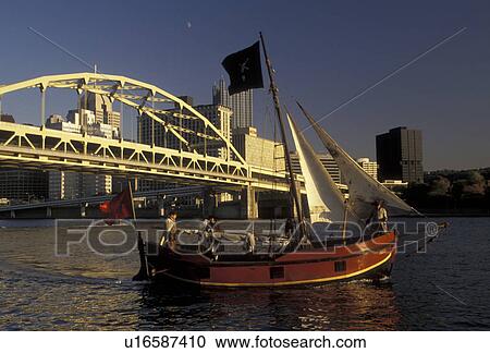 Pittsburgh, boat, bridge, skyline, Pennsylvania, A pirate boat cruises along the Allegheny River with the Fort Duquesne Bridge and downtown skyline of Pittsburgh behind in the state of Pennsylvania. View Large Photo Image Stock Image - Pittsburgh, boat, bridge, skyline, Pennsylvania, A pirate boat cruises along the Allegheny River with the Fort Duquesne Bridge and downtown skyline of Pittsburgh behind in the state of Pennsylvania. . Fotosearch