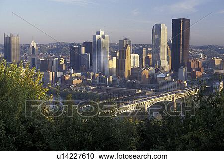 Stock Image -  Pittsburgh, downtown skyline, Pennsylvania, A scenic aerial view of the downtown skyline of Pittsburgh from across the Monongahela River from Mount Washington in the state of Pennsylvania. . Fotosearch