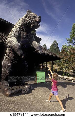 Portland, World Forestry Center, museum, grizzly bear, Oregon, Young six year old girl pretends to charge a large statue of a grizzly bear at the World Forestry Center in Washington Park in Portland in the state of Oregon. View Large Photo Image Picture - Portland, World Forestry Center, museum, grizzly bear, Oregon, Young six year old girl pretends to charge a large statue of a grizzly bear at the World Forestry Center in Washington Park in Portland in the state of Oregon.. Fotosearch