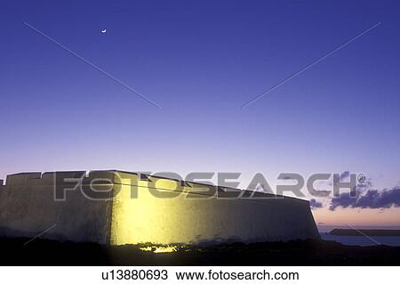Portugal, Algarve, fort, Fortaleza de Sagres is illuminated in the evening along the Algarve Coast of the Atlantic Ocean. View Large Photo Image Stock Image - Portugal, Algarve, fort, Fortaleza de Sagres is illuminated in the evening along the Algarve Coast of the Atlantic Ocean.. Fotosearch
