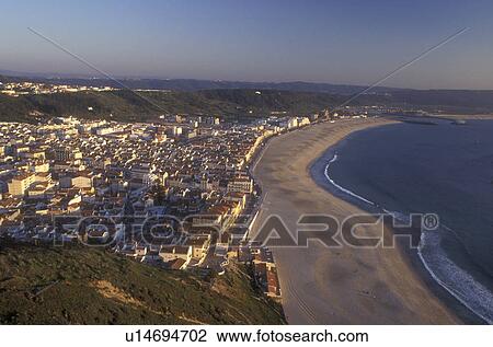 Portugal, Nazare, Aerial view of the picturesque seaside fishing village of Nazare on the Atlantic Ocean View Large Photo Image Stock Image - Portugal, Nazare, Aerial view of the picturesque seaside fishing village of Nazare on the Atlantic Ocean . Fotosearch