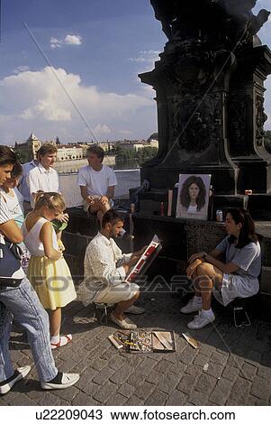 Prague, Czech Republic, street artist, Charles Bridge, Europe, Street artist painting a picture of a woman on the Charles Bridge in Prague. View Large Photo Image Stock Image - Prague, Czech Republic, street artist, Charles Bridge, Europe, Street artist painting a picture of a woman on the Charles Bridge in Prague.. Fotosearch