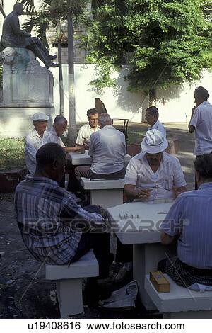 Puerto Rico, Caribbean, San Juan, Porto Rico, Caribbean Islands, Local men playing dominoes on cement tables in a park in Old San Juan, Puerto Rico. View Large Photo Image Stock Photograph - Puerto Rico, Caribbean, San Juan, Porto Rico, Caribbean Islands, Local men playing dominoes on cement tables in a park in Old San Juan, Puerto Rico. . Fotosearch